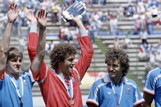 Albert Rust raises his hands after France beat Belgium to finish third at the 1986 World Cup.