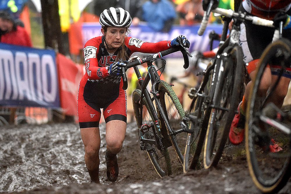 Ellen Noble (USA) pushes through the mud