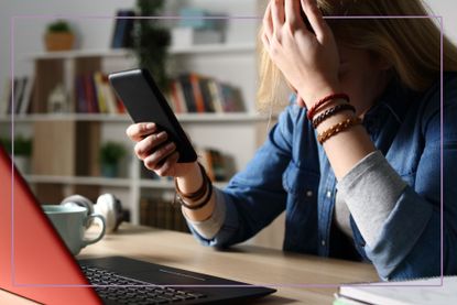 Teen looking sad at phone