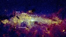 We see a beautiful cloud of yellowish gas illumated by starlight at the galaxy's center, on a dark blue background