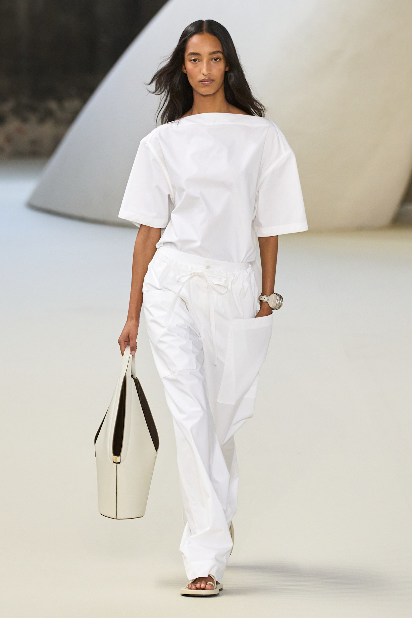A model walking in Tod's S/S 25 show.