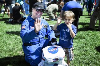 An unidentified man and child were at Griffith Observatory, Los Angeles, for the flyover of shuttle Endeavour on Sept. 21, 2012.