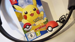 Photo taken by writer Rosalie Newcombe of the Pokeball Plus controller, Ring Fit Adventure Ring-con and the box of Pokemon Let's Go Pikachu on the Nintendo Switch.