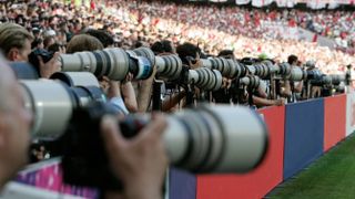 Canon white lenses at a sporting event