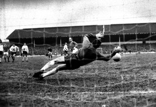 Tottenham goalkeeper Pat Jennings saves a penalty from Manchester United's Bobby Charlton in February 1968.