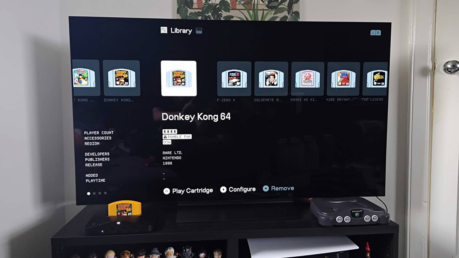 Analogue 3D connected to LG OLED C4 TV with Library displayed featuring cartridges and meta data.