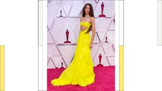 Zendaya wears a yellow, tulle cut-out dress as she attends the 93rd Annual Academy Awards at Union Station on April 25, 2021 in Los Angeles, California.