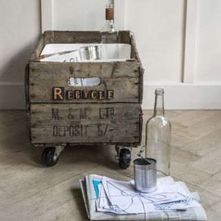 room with wooden recycling hub with wheels