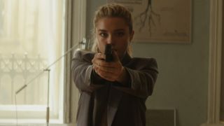Florence Pugh as Yelena holding a gun in Black Widow