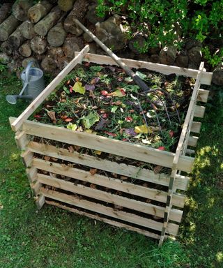 Wooden home made compost bin for a garden