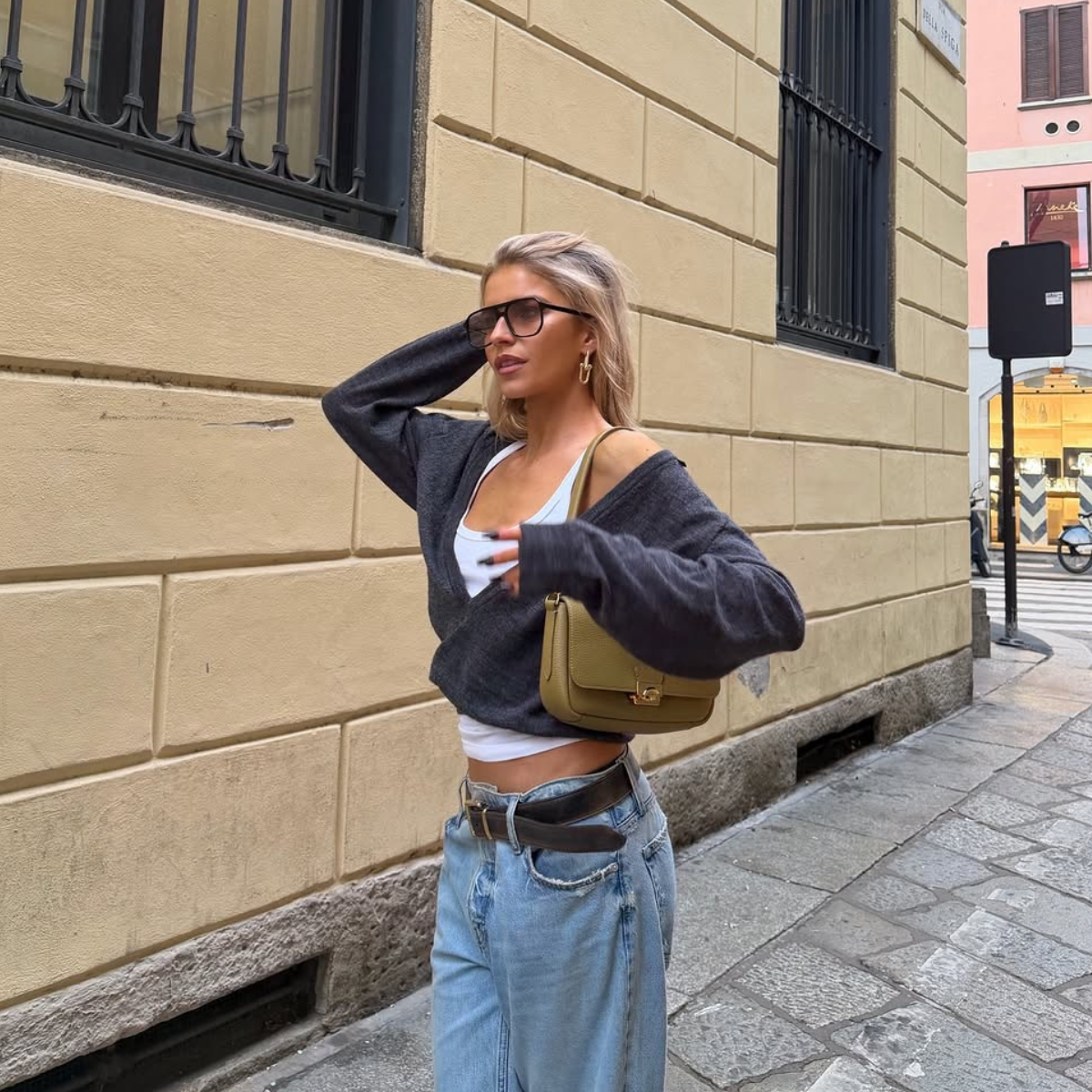 woman wearing gray sweater spring outfit 2026