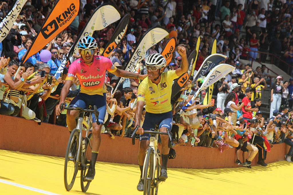 Venezuela's Eduin Becerra (R), from team Trululu Grupo La Guacamaya, celebrates after winning the 60th 'Vuelta al Tachira' road bicycle race between San Rafael del Pi&ntilde;al and Cerro del Cristo Rey in San Cristobal, Tachira State, Venezuela on January 19, 2025. (Photo by Johnny PARRA / AFP)