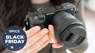Sony A6600 being held by the reviewer now reduced for black friday