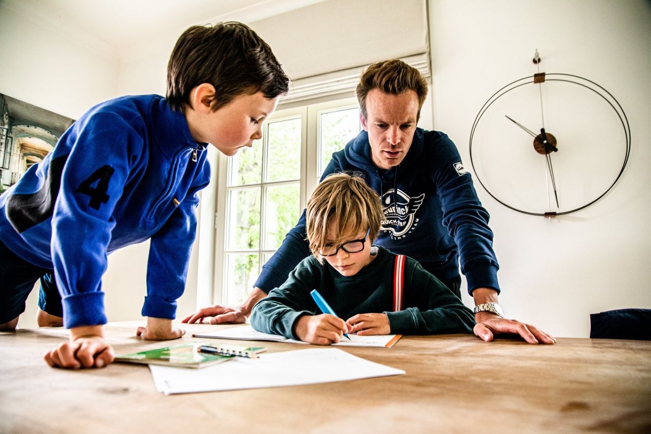Iljo Keisse helping his sons with their homework