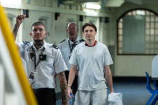 Tom entering the prison for the first time.