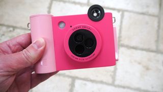 Kodak Smile+ camera in pink held in a hand