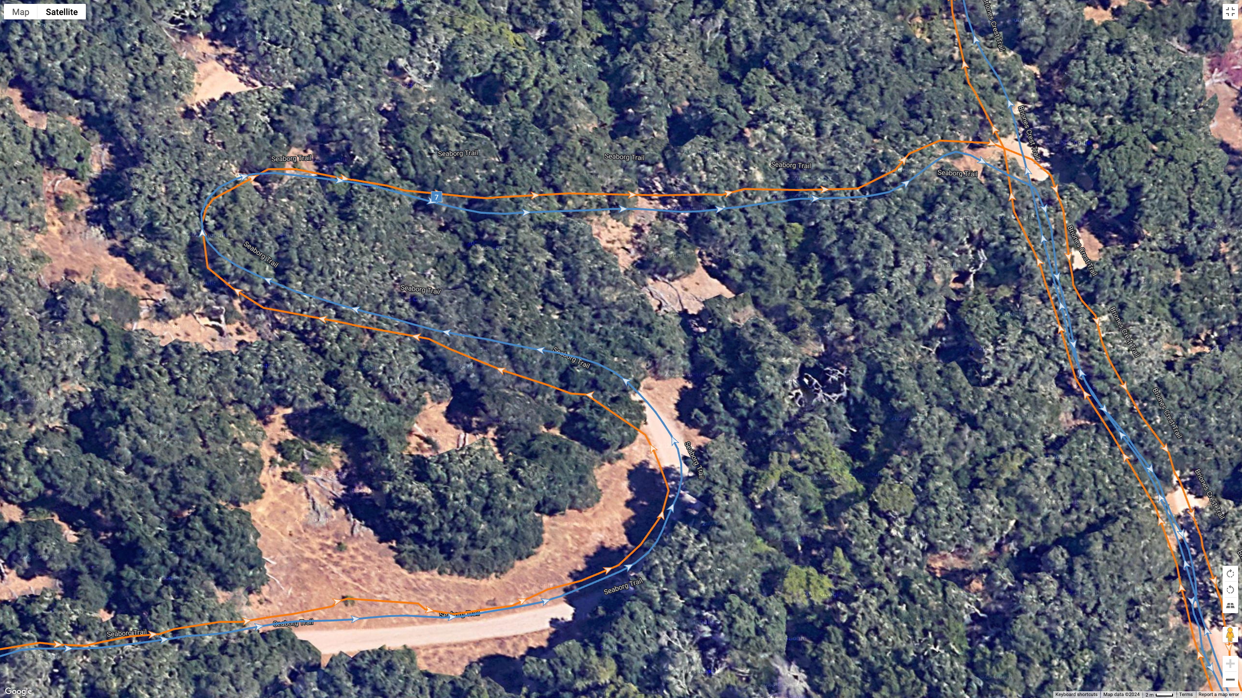 A Google Earth satellite image showing how the COROS PACE Pro (blue line) compares to the Garmin Fenix 8 (orange line) for a dual-band GPS accuracy test.