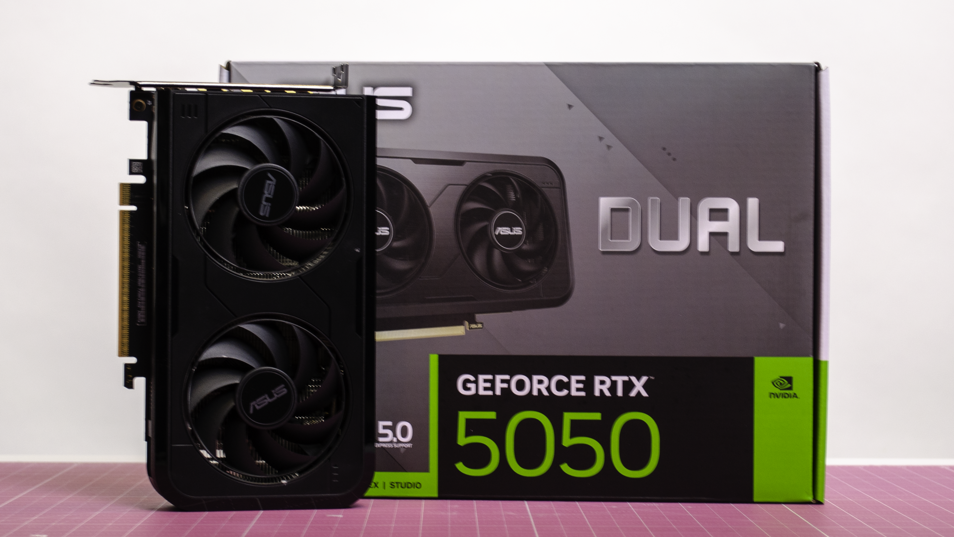 An RTX 5050 on a desk with its retail packaging
