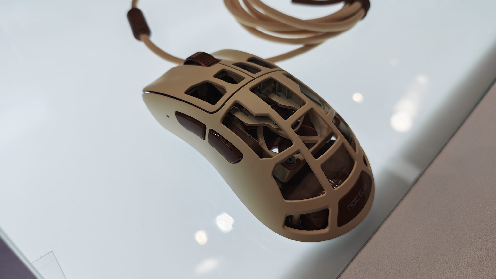 The Pulsar Feinmann F01 Noctua Edition mouse on a display table at Computex 2026