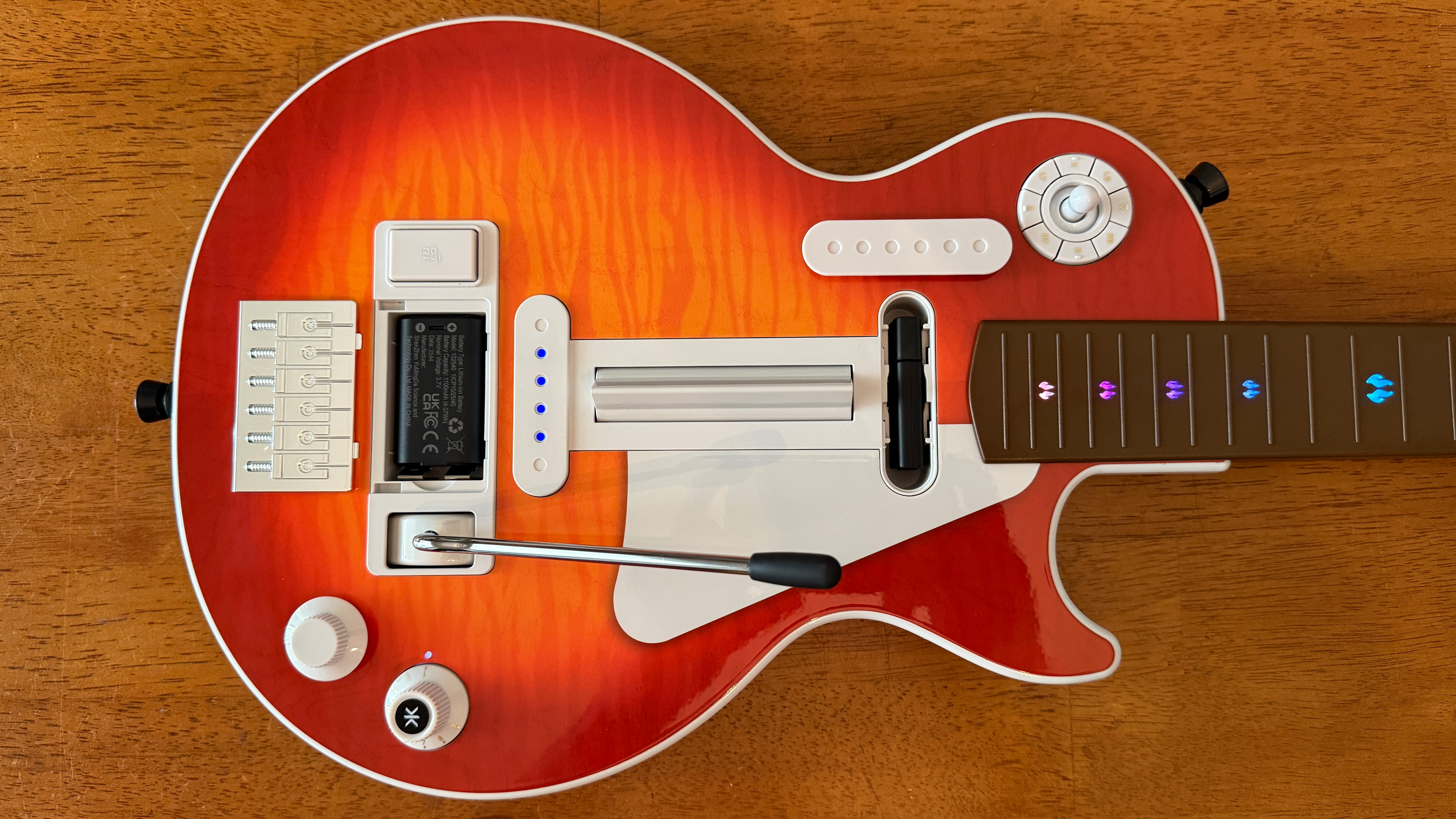 The compartments on the body of the CRKD Gibson Les Paul Pro Edition Guitar