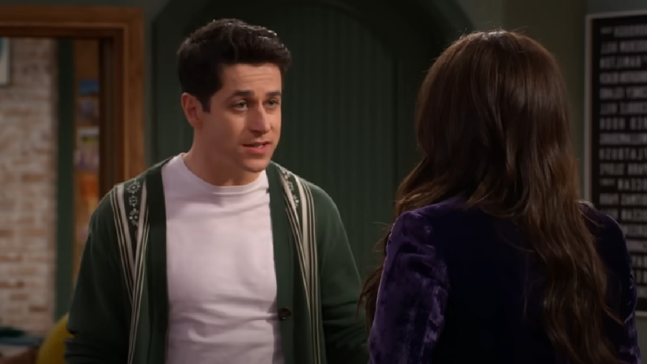 David Henrie talking to Selena Gomez at Wizards Beyond Waverly Place.