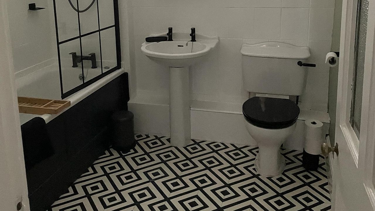 monochrome bathroom with patterned floor tiles