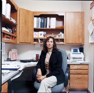 a brunette woman in a medical office