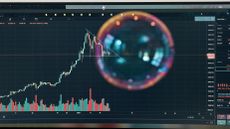 Image of a bubble over a falling stock market graph.