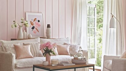Wood-panelled wall in light pink with a home office set up