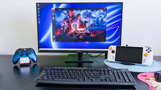 OMEN 27k gaming monitor next to ROG Ally and Xbox Controller.