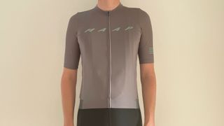 Male cyclist wearing Maap Pro Evade Base Jersey 2.0 in gargoyle grey