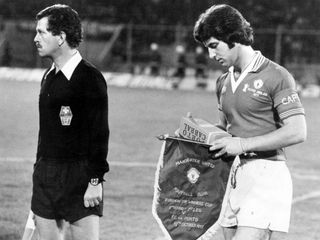 Porto v Manchester United, European Cup Winners Cup 1st leg match at The Est‡dio do Drag‹o, Porto, Portugal, 19th October 1977, Martin Buchan, Manchester United Captain with Club Pennant, Final score: Porto 4 - 0 Man Utd.