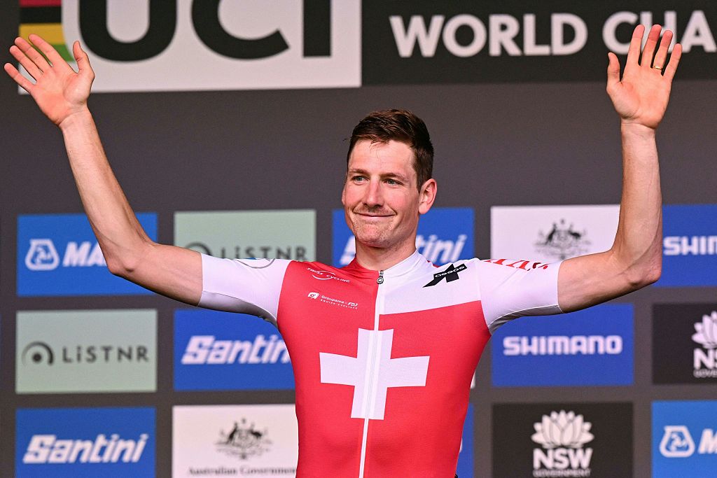 Silver medallist Switzerland's Stefan Kung celebrates on the podium after the men's individual elite time trial cycling event at the UCI 2022 Road World Championship in Wollongong