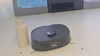 Midea WashBot combination robot vacuum / washing machine being demoed at IFA