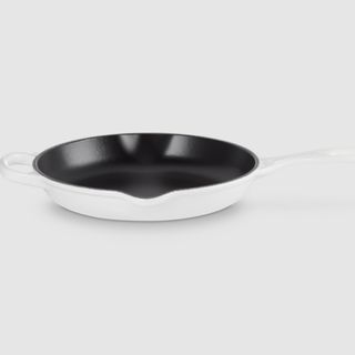 White Le Creuset cast iron skillet