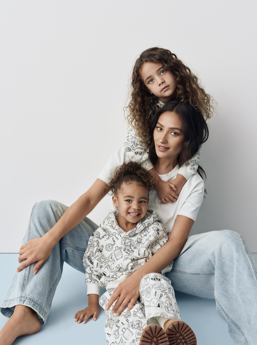 Shay posed with her children, Atlas and Rome in head-to-toe BÉIS x Gap.