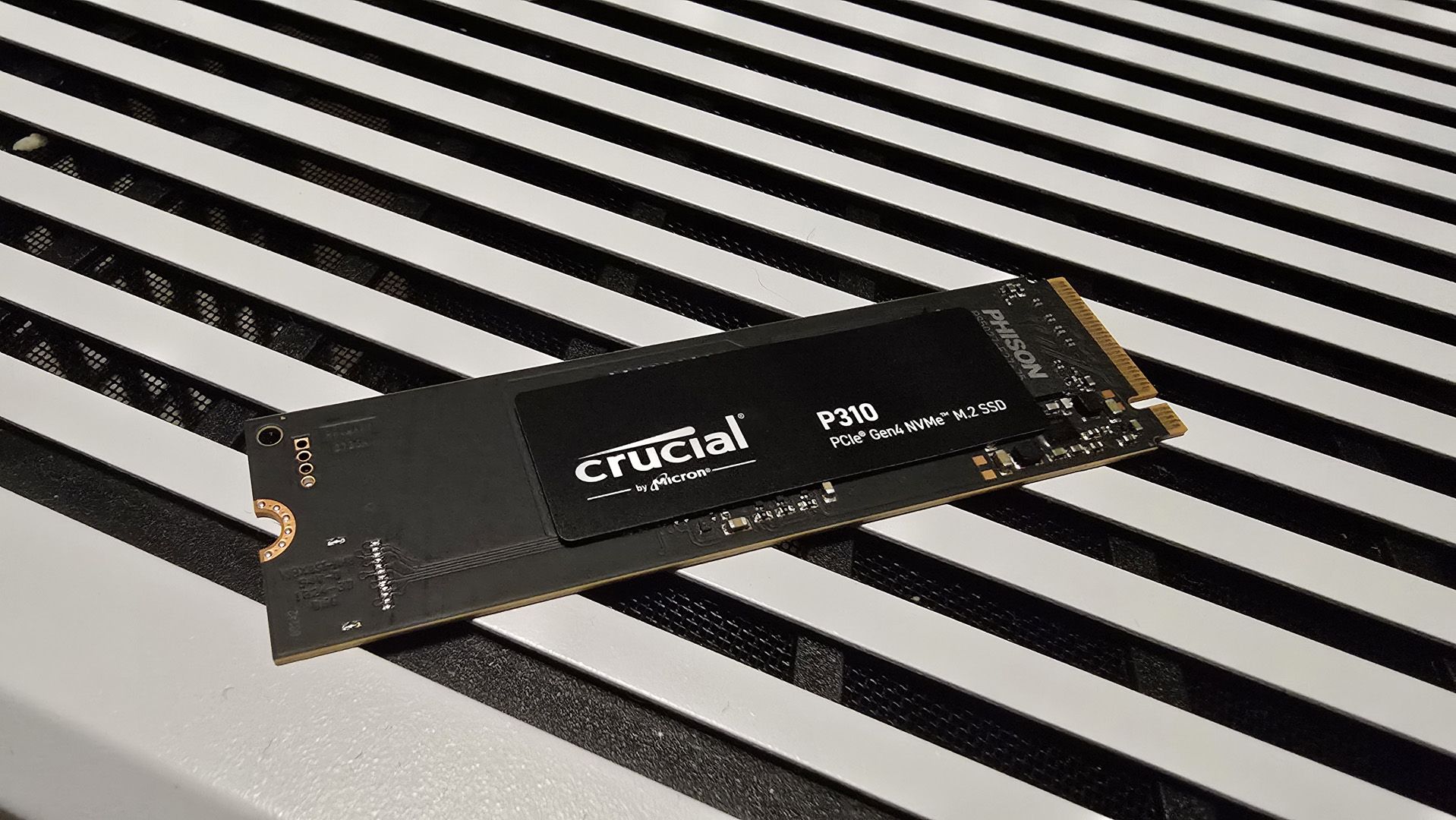 A Crucial P310 SSD installed inside a gaming PC.