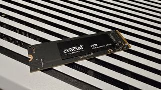 A Crucial P310 SSD installed inside a gaming PC.