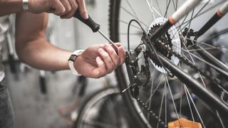 Person carrying out bike maintenance