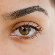 Close up of woman's eye and eyebrow