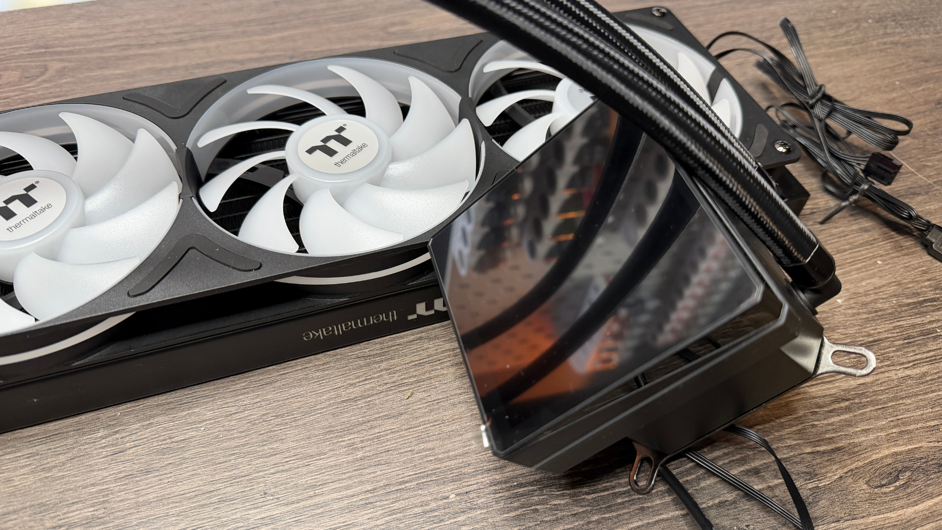 Thermaltake TH360 V3 Ultra ARGB Sync outside of a PC case with fans installed.