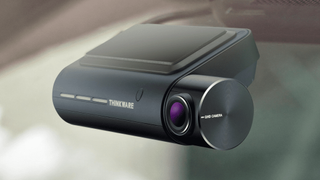 The Thinkware F800 Pro dash cam inside a car windshield
