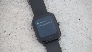 An Amazfit Bip U Pro with the screen on