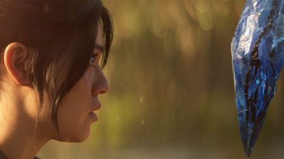 Diablo 4's Nyrelle looks at a crystal in Vessel of Hatred's trailer