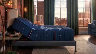 The Stearns & Foster The Lux Estate mattress in a red brick industrial style luxury bedroom