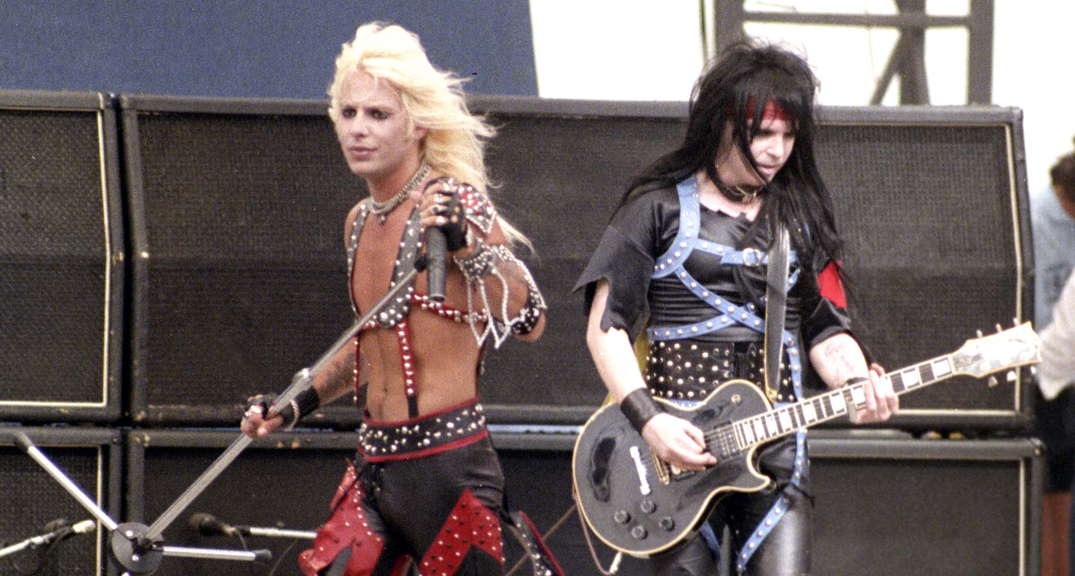 Vince Neil and Mick Mars perform at the US Festival 1983.