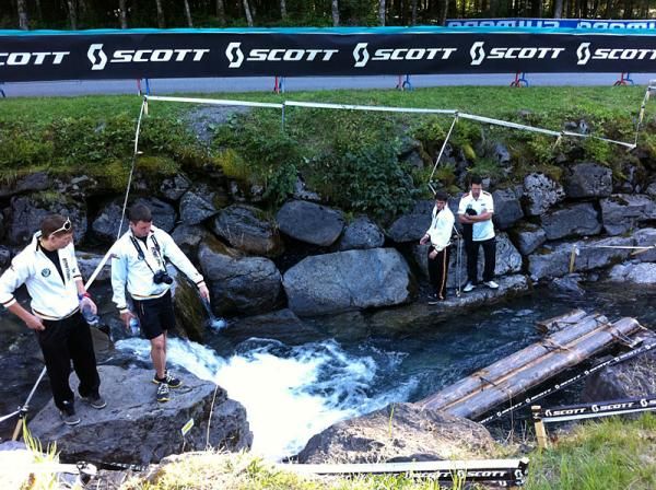 The German team checks out part of the trials course and yes, it IS in a stream.