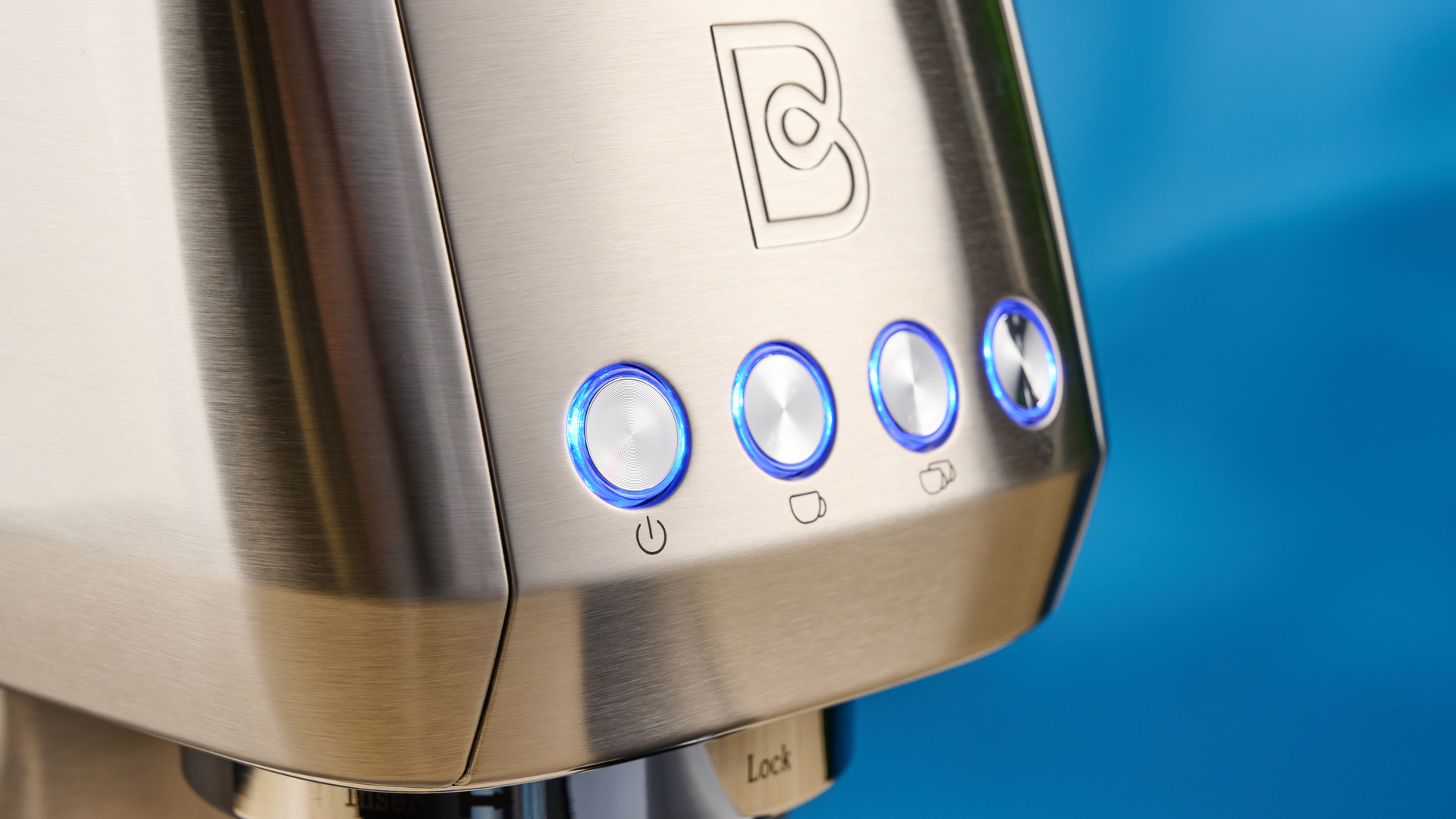 the casabrews 3700 essential espresso machine in silver with a compact footprint and shiny reflective metal casing