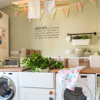 Laundry room with wooden Sheila's Maid, Belfast sink, washing machine and tumble dryer