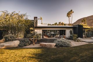 rancho mirage house showcasing low lying, modernist architecture with lots of desert planting and outdoor areas